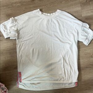 Matilda Jane women’s cream top with designs at bottom, worn lightly, size M